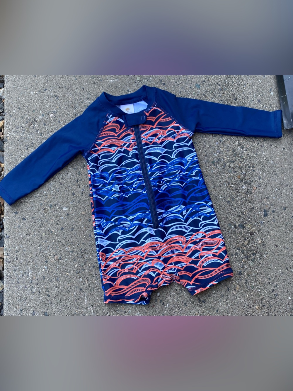 Tucker + Tate Navy Rashguard One-Piece with Coral & Light Blue Wave Print